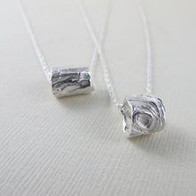 Load image into Gallery viewer, Driftwood imprinted infinity bead necklace from Mystic Beach, Vancouver Island - Swallow Jewellery