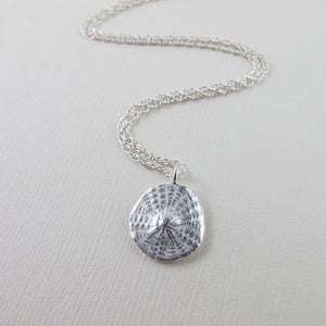 Sand dollar imprinted necklace from Parksville, Vancouver Island - Swallow Jewellery