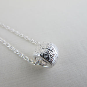 Driftwood imprinted infinity bead necklace from Burgoyne Bay, Saltspring Island