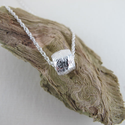 Driftwood imprinted infinity bead necklace from Burgoyne Bay, Saltspring Island