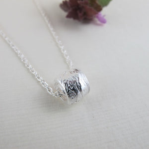 Driftwood imprinted infinity bead necklace from Burgoyne Bay, Saltspring Island